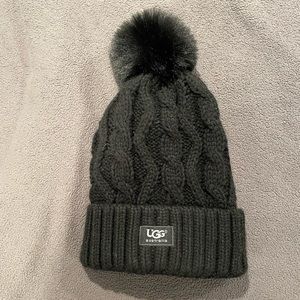 Black hat with fur puff